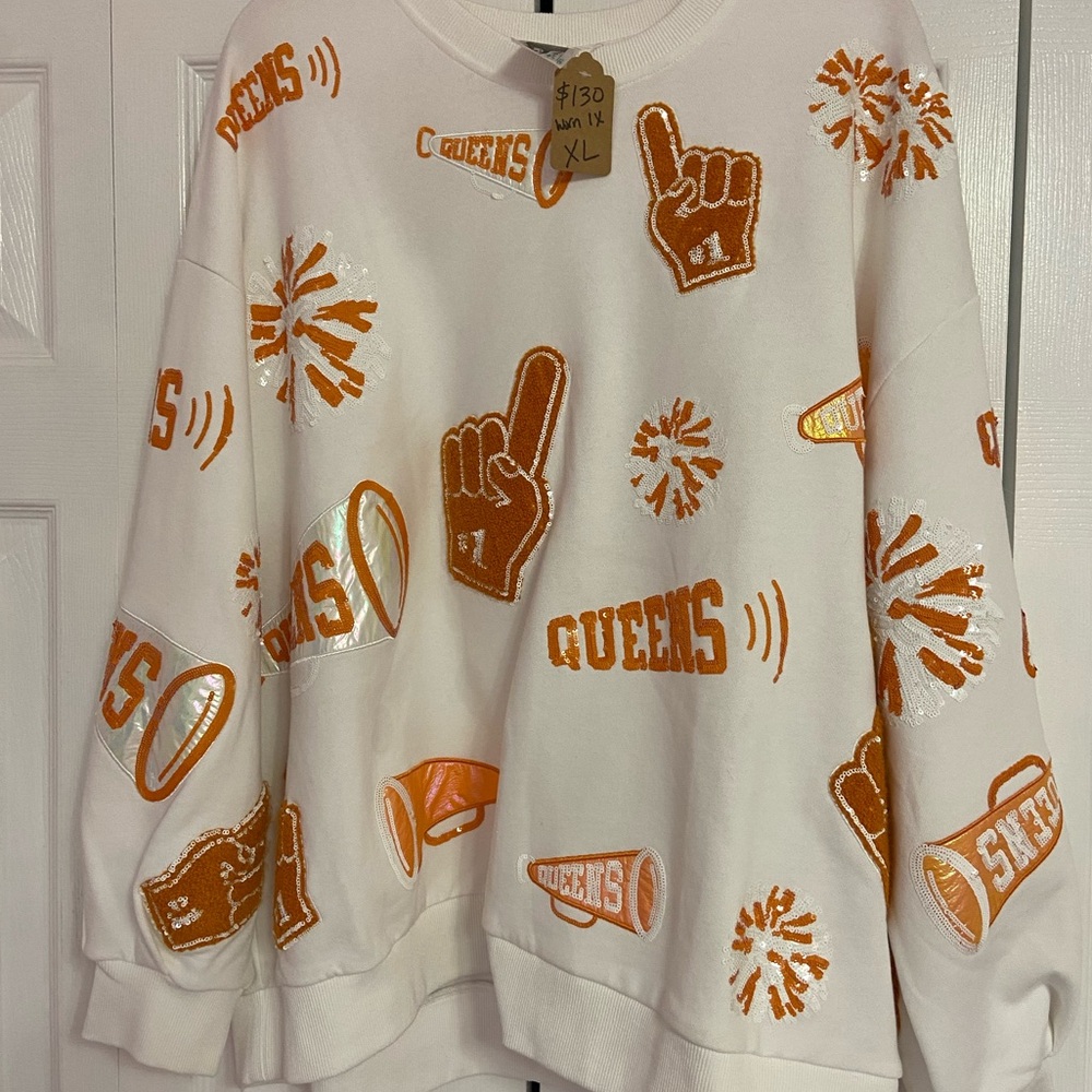 Queen of Sparkles orange and white cheers sweatshirt worn twice. QOS